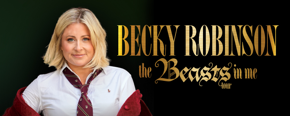 Becky Robinson, a women with short blonde hair wearing a white blouse with red tie and jacket.